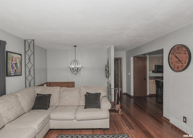 4512 11th Ave Unit C, Moline, IL 61265 - living room with dark wood-style floors and a chandelier