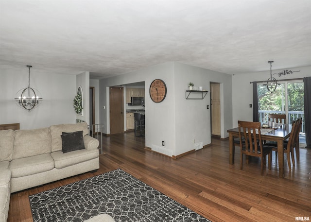 4512 11th Ave Unit C, Moline, IL 61265 - living room featuring a chandelier and dark wood-type flooring