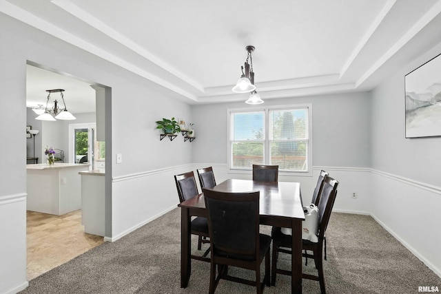 732 W 59th St, Davenport, IA 52806 - dining space with light carpet and a tray ceiling