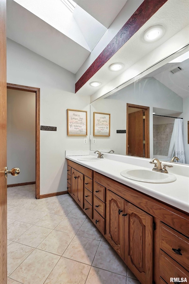 732 W 59th St, Davenport, IA 52806 - bathroom featuring double vanity, vaulted ceiling, tile patterned flooring, and curtained shower