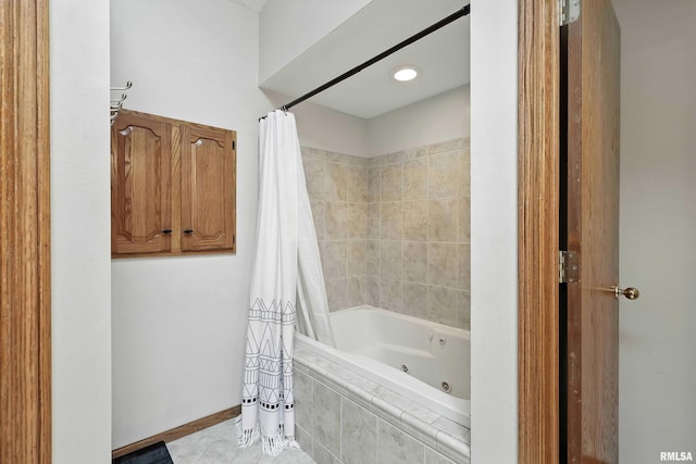 732 W 59th St, Davenport, IA 52806 - bathroom featuring a combined bath / shower with jetted tub and tile patterned flooring
