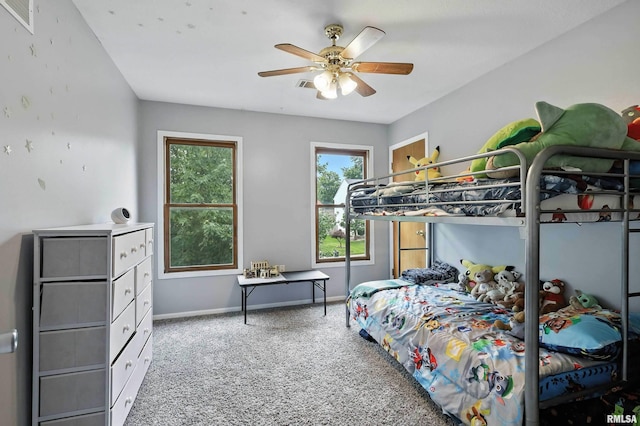 732 W 59th St, Davenport, IA 52806 - carpeted bedroom featuring baseboards and ceiling fan