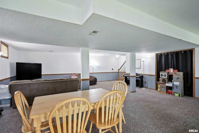 732 W 59th St, Davenport, IA 52806 - dining room with carpet flooring, a textured ceiling, and stairway