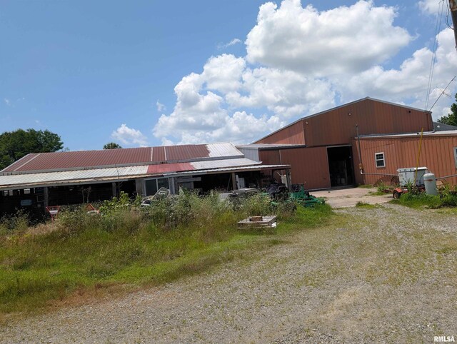 340 Dameron Ln, Vienna, IL 62995 - rear view of property featuring a pole building, an outbuilding, and a metal roof