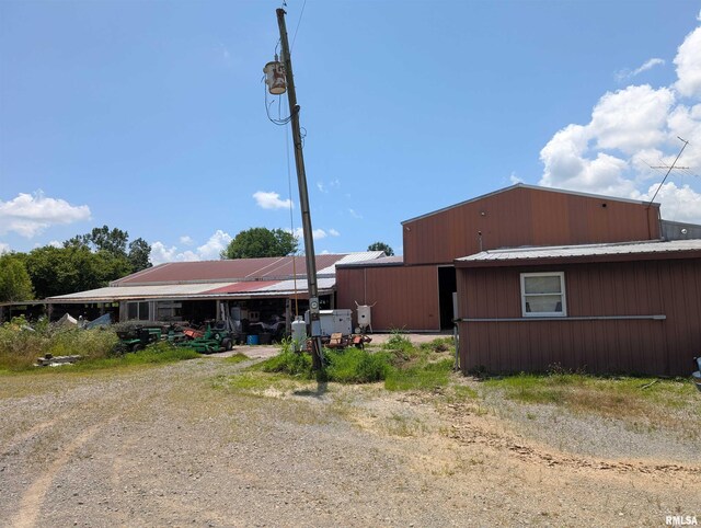 340 Dameron Ln, Vienna, IL 62995 - rear view of house with a metal roof and dirt driveway