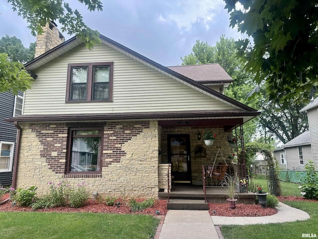 1723 Pershing Blvd, Clinton, IA 52732 - view of front of property with covered porch and a chimney
