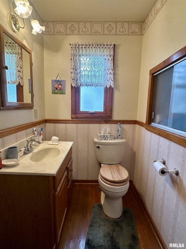 1723 Pershing Blvd, Clinton, IA 52732 - half bath with wood finished floors, vanity, and wainscoting