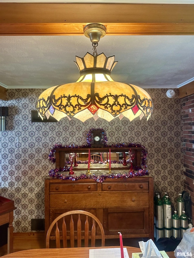 1723 Pershing Blvd, Clinton, IA 52732 - dining space featuring wallpapered walls and crown molding