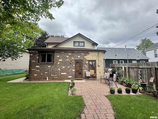 1723 Pershing Blvd, Clinton, IA 52732 - rear view of property with a patio area and brick siding