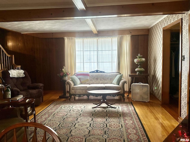 1723 Pershing Blvd, Clinton, IA 52732 - living area with light wood-style floors, beamed ceiling, stairs, and wallpapered walls