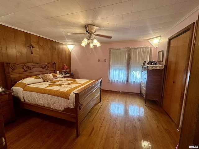 1723 Pershing Blvd, Clinton, IA 52732 - bedroom with light wood-type flooring, crown molding, and ceiling fan