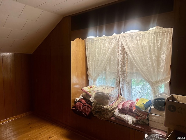 1723 Pershing Blvd, Clinton, IA 52732 - additional living space featuring lofted ceiling, wood finished floors, and wooden walls