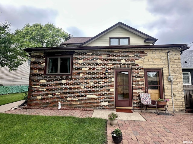 1723 Pershing Blvd, Clinton, IA 52732 - view of front of home with a patio area and brick siding
