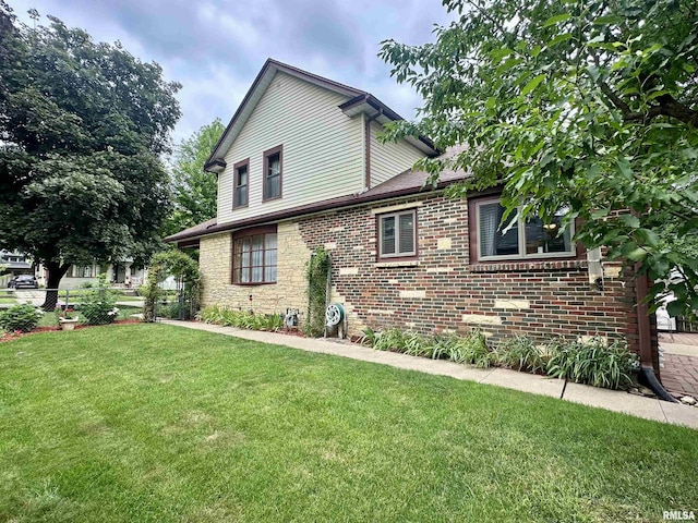 1723 Pershing Blvd, Clinton, IA 52732 - view of property exterior featuring brick siding