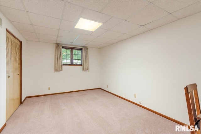 17223 N Cedar Rd, East Moline, IL 61244 - unfurnished bedroom featuring light colored carpet, a paneled ceiling, and a closet