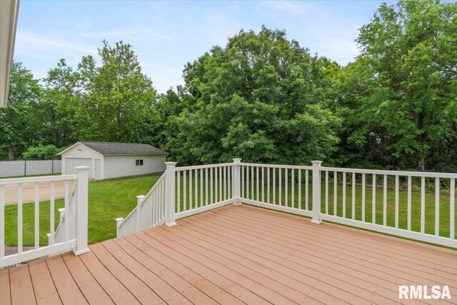 17223 N Cedar Rd, East Moline, IL 61244 - wooden deck with an outbuilding and a yard