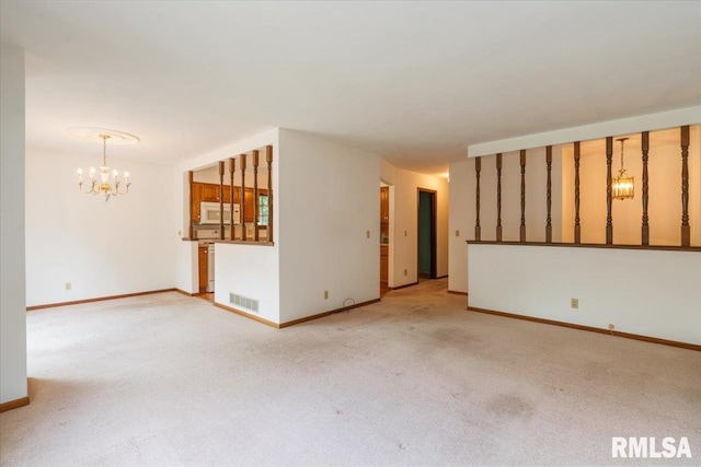 17223 N Cedar Rd, East Moline, IL 61244 - unfurnished room with a chandelier and light colored carpet
