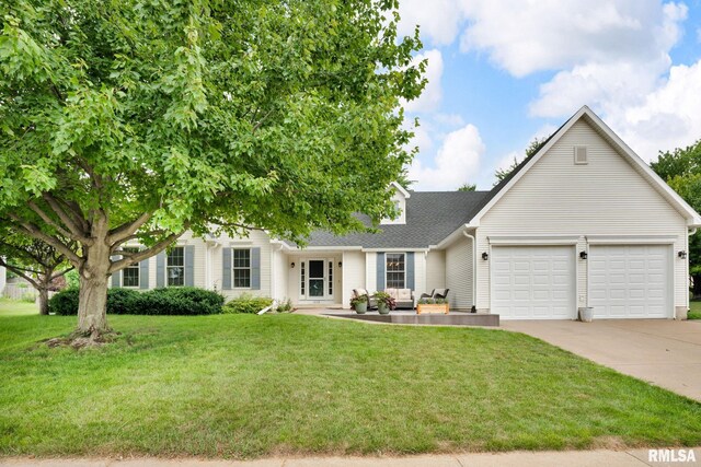 1039 Bluff Ln, Le Claire, IA 52753 - view of front of house with driveway, an attached garage, a front lawn, roof with shingles, and an outdoor living space
