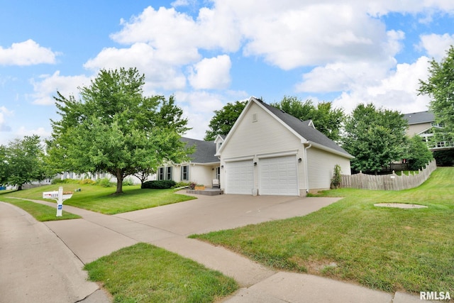 1039 Bluff Ln, Le Claire, IA 52753 - view of front facade with a garage and concrete driveway