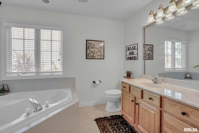 1039 Bluff Ln, Le Claire, IA 52753 - full bath featuring a garden tub, vanity, and tile patterned flooring