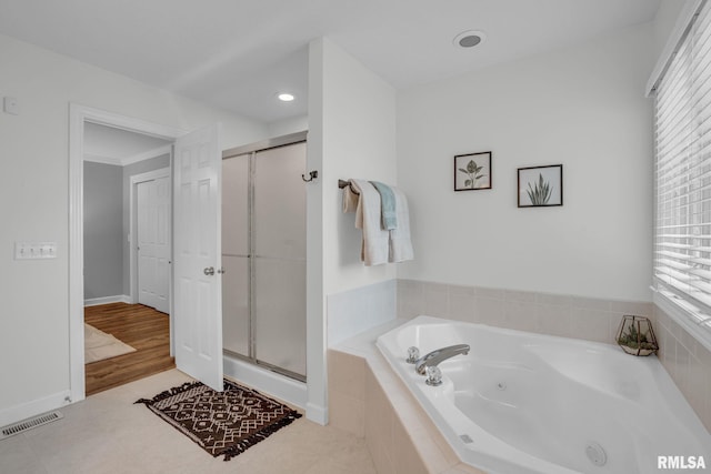 1039 Bluff Ln, Le Claire, IA 52753 - full bathroom featuring a stall shower and a jetted tub
