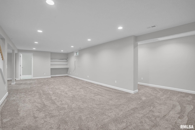 1039 Bluff Ln, Le Claire, IA 52753 - finished below grade area with light carpet and recessed lighting