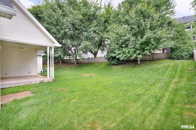 1039 Bluff Ln, Le Claire, IA 52753 - view of yard with a ceiling fan and a patio area