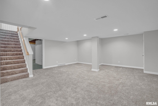 1039 Bluff Ln, Le Claire, IA 52753 - finished below grade area with carpet flooring, stairway, and recessed lighting