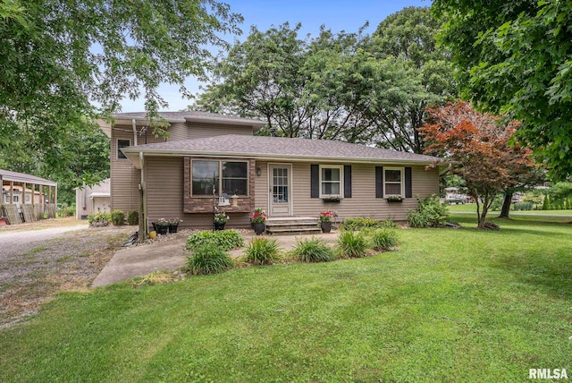 13118 65th Ave, Blue Grass, IA 52726 - view of front of house with a front lawn and a shingled roof