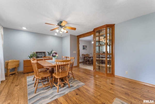 13118 65th Ave, Blue Grass, IA 52726 - dining space featuring a ceiling fan, light wood-style floors, a textured ceiling, and recessed lighting