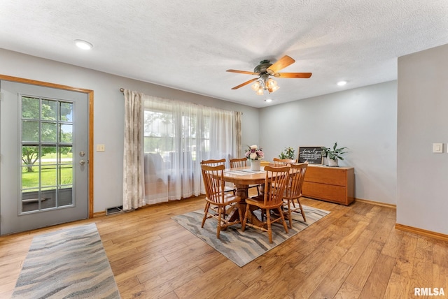 13118 65th Ave, Blue Grass, IA 52726 - dining space featuring ceiling fan, light wood-style flooring, a textured ceiling, and recessed lighting