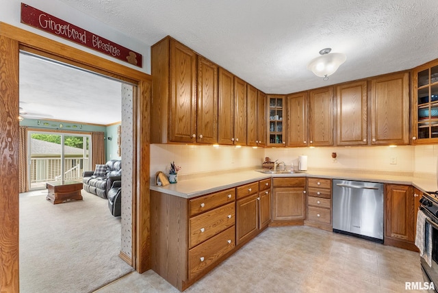 13118 65th Ave, Blue Grass, IA 52726 - kitchen featuring dishwasher, brown cabinetry, glass insert cabinets, a textured ceiling, and light countertops