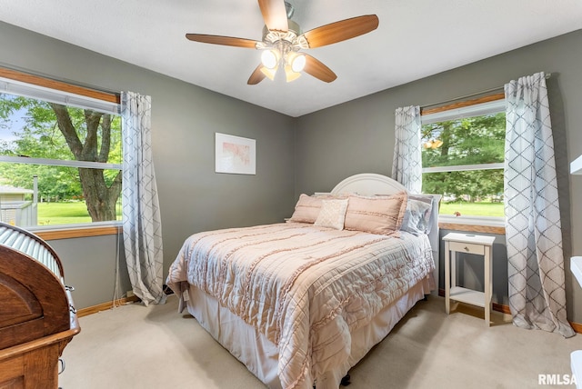 13118 65th Ave, Blue Grass, IA 52726 - bedroom featuring light colored carpet and ceiling fan