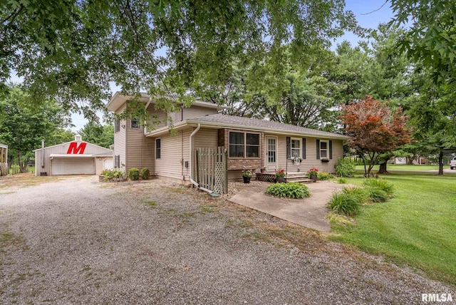 13118 65th Ave, Blue Grass, IA 52726 - view of front of house featuring an outbuilding, a detached garage, and a front yard