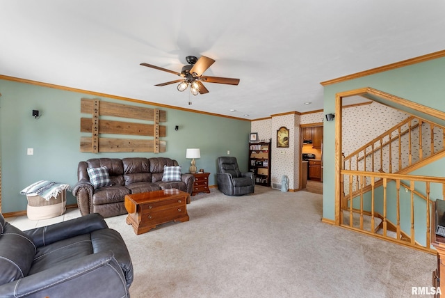 13118 65th Ave, Blue Grass, IA 52726 - carpeted living room with ornamental molding, a ceiling fan, and stairs