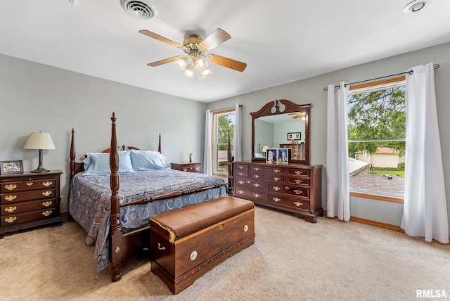 13118 65th Ave, Blue Grass, IA 52726 - carpeted bedroom with a ceiling fan and baseboards