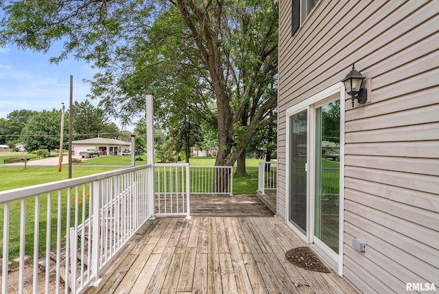 13118 65th Ave, Blue Grass, IA 52726 - wooden porch with a lawn