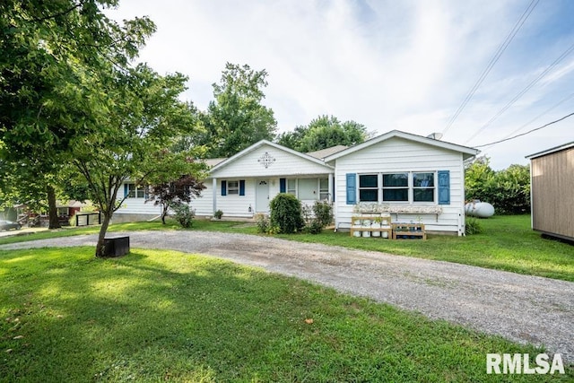 17000 Log Cabin Rd, Marion, IL 62959 - view of front of home featuring a front lawn, covered porch, and driveway