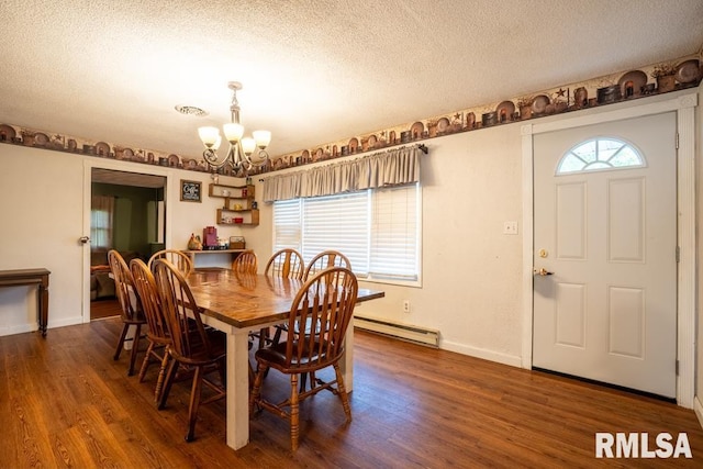 17000 Log Cabin Rd, Marion, IL 62959 - dining space featuring a baseboard radiator, a chandelier, wood finished floors, and a textured ceiling