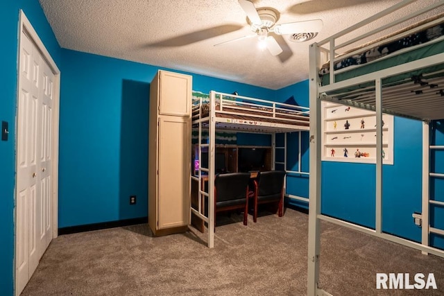 17000 Log Cabin Rd, Marion, IL 62959 - unfurnished bedroom featuring carpet flooring, ceiling fan, and a textured ceiling