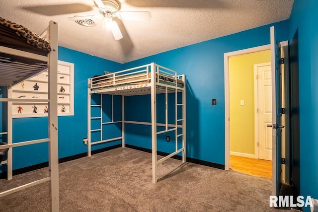 17000 Log Cabin Rd, Marion, IL 62959 - unfurnished bedroom featuring carpet flooring, a textured ceiling, and ceiling fan