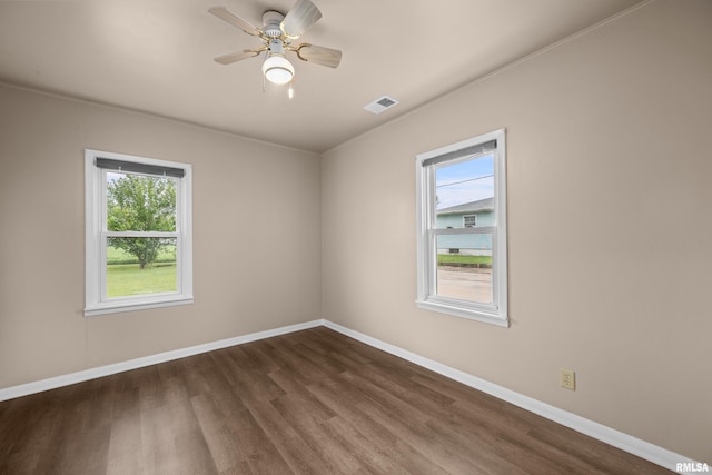 1671 US Highway 67, Preemption, IL 61276 - empty room featuring plenty of natural light, dark wood-style flooring, and a ceiling fan