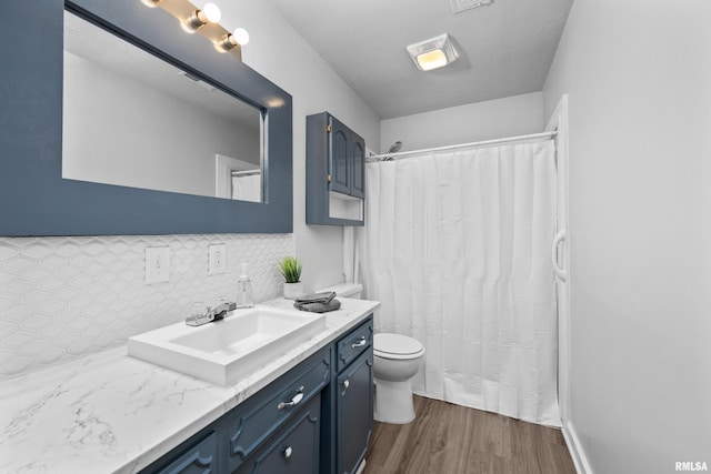 1671 US Highway 67, Preemption, IL 61276 - bathroom with vanity, wood finished floors, tasteful backsplash, and curtained shower