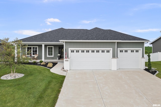 5835 Pigeon Creek Rd, Bettendorf, IA 52722 - single story home featuring an attached garage, concrete driveway, roof with shingles, and board and batten siding