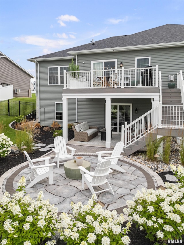 5835 Pigeon Creek Rd, Bettendorf, IA 52722 - back of property with a patio, stairway, and a shingled roof