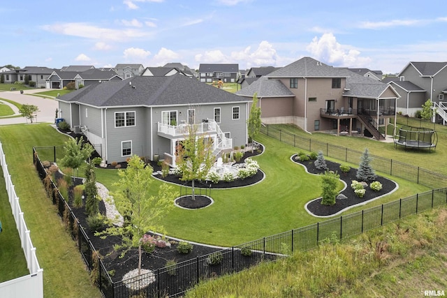 5835 Pigeon Creek Rd, Bettendorf, IA 52722 - rear view of house with stairs, a residential view, a trampoline, a wooden deck, and a vegetable garden