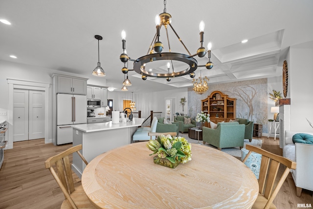5835 Pigeon Creek Rd, Bettendorf, IA 52722 - dining space with coffered ceiling, a chandelier, recessed lighting, light wood-style floors, and beamed ceiling
