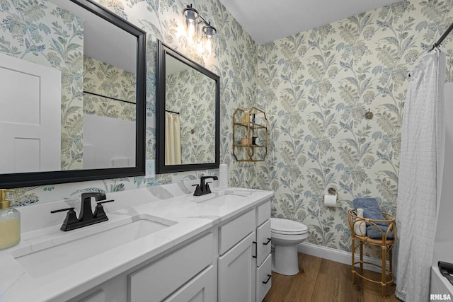 5835 Pigeon Creek Rd, Bettendorf, IA 52722 - full bath with wallpapered walls, wood finished floors, double vanity, and a shower with shower curtain