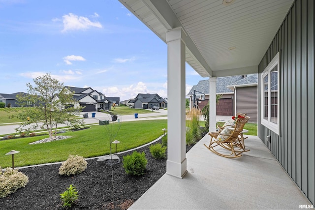 5835 Pigeon Creek Rd, Bettendorf, IA 52722 - covered porch with a residential view and a lawn