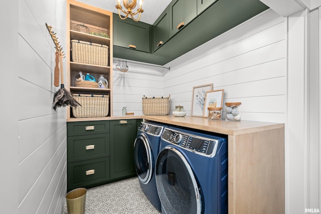 5835 Pigeon Creek Rd, Bettendorf, IA 52722 - washroom with cabinet space, independent washer and dryer, and a chandelier